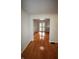 Sunlit living room with gleaming hardwood floors, views of the doorway, and neutral walls at 1739 Forest Dr, Indianapolis, IN 46227