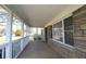 Inviting front porch of a charming home, featuring stone facade and ample natural light at 1739 Forest Dr, Indianapolis, IN 46227