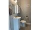 Compact bathroom with a white vanity, toilet, and modern fixtures at 1913 Albany St, Beech Grove, IN 46107