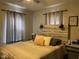 Comfortable bedroom with wooden headboard, lamps, and natural light at 1913 Albany St, Beech Grove, IN 46107