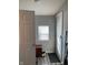 Clean entryway with bench, window, and neutral color scheme at 1913 Albany St, Beech Grove, IN 46107