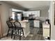 Modern kitchen with white cabinets, stainless steel appliances, and a breakfast bar at 1913 Albany St, Beech Grove, IN 46107