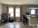 Cozy living area with hardwood floors, breakfast bar, and ample natural light at 1913 Albany St, Beech Grove, IN 46107