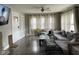 Comfortable living room with hardwood floors, gray sofa, and bright natural light at 1913 Albany St, Beech Grove, IN 46107