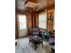 Relaxing porch features wood walls, string lights, and a cozy seating area at 1913 Albany St, Beech Grove, IN 46107