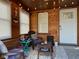 Inviting sunroom porch with wood paneling, string lights, and comfortable seating arrangements at 1913 Albany St, Beech Grove, IN 46107