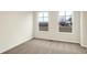 Neutral bedroom with two windows letting in lots of natural light and plush neutral colored carpeting at 19499 Grassy Branch Rd, Westfield, IN 46074