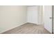 A carpeted bedroom with neutral walls and a closet with folding doors at 19499 Grassy Branch Rd, Westfield, IN 46074
