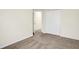 A carpeted bedroom with neutral walls and a closet with folding doors at 19499 Grassy Branch Rd, Westfield, IN 46074