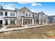 New two-story townhomes featuring brick and various colored siding at 19499 Grassy Branch Rd, Westfield, IN 46074