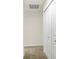 Hallway featuring neutral-colored carpet and white double doors leading to a closet or storage area at 19499 Grassy Branch Rd, Westfield, IN 46074