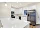 Modern kitchen with white cabinets, stainless steel appliances, and quartz countertops at 19499 Grassy Branch Rd, Westfield, IN 46074
