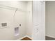 Clean laundry area with utility hook-ups, wire shelving for storage and luxury vinyl flooring at 19499 Grassy Branch Rd, Westfield, IN 46074