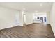 Open floor plan showcasing living room, a partial bathroom, and kitchen at 19499 Grassy Branch Rd, Westfield, IN 46074