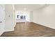 Open concept featuring laminate flooring, white walls, and kitchen area at 19499 Grassy Branch Rd, Westfield, IN 46074
