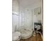 Compact bathroom with a toilet, shower, and small sink area at 2370 N Moreland Ave, Indianapolis, IN 46222