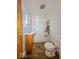 Bathroom with vintage-style bathtub, toilet, and sink at 2370 N Moreland Ave, Indianapolis, IN 46222
