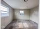 Modest bedroom featuring two windows and worn neutral carpet at 2370 N Moreland Ave, Indianapolis, IN 46222
