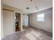 Modest bedroom featuring a closet, window, and view to the bathroom at 2370 N Moreland Ave, Indianapolis, IN 46222