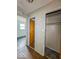 Hallway with hardwood flooring and access to multiple rooms and closet space at 2370 N Moreland Ave, Indianapolis, IN 46222