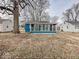 Cozy sunroom addition offers abundant natural light and complements the exterior of this charming home at 2370 N Moreland Ave, Indianapolis, IN 46222