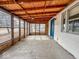 Enclosed sunroom with natural wood ceiling and large windows providing ample natural light at 2370 N Moreland Ave, Indianapolis, IN 46222