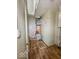 Compact utility room featuring updated flooring and essential mechanical components at 2370 N Moreland Ave, Indianapolis, IN 46222