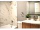 Modern bathroom with tiled walls and a sleek vanity offering a refreshing and stylish space at 2908 N Colorado Ave, Indianapolis, IN 46218