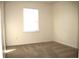 Bright bedroom featuring carpeted floors, neutral paint and a window providing natural light at 2908 N Colorado Ave, Indianapolis, IN 46218