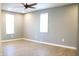 Bright bedroom with neutral walls and two windows providing ample natural light, creating a serene retreat at 2908 N Colorado Ave, Indianapolis, IN 46218