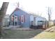 Charming blue home with wood shutters, inviting front porch, and a side deck, perfect for outdoor enjoyment at 2908 N Colorado Ave, Indianapolis, IN 46218