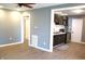 Open floor plan featuring stylish gray walls and wood floors, flows seamlessly into the adjacent kitchen at 2908 N Colorado Ave, Indianapolis, IN 46218
