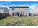 Large backyard with a patio, seating, grill, and well-maintained lawn at 3079 Limber Pine Dr, Whiteland, IN 46184