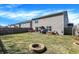 Large fenced backyard with a fire pit and a patio perfect for entertaining outdoors at 3079 Limber Pine Dr, Whiteland, IN 46184