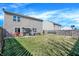 Spacious backyard featuring a patio area, lush lawn, and a wooden fence for privacy at 3079 Limber Pine Dr, Whiteland, IN 46184