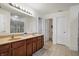 This bathroom features double sinks, a vanity, and a large mirror with lights at 3079 Limber Pine Dr, Whiteland, IN 46184