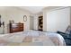 Bedroom features dresser and mirror, closet space, and neutral walls at 3079 Limber Pine Dr, Whiteland, IN 46184