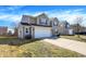 A well-maintained two-story home with a two-car garage, vinyl siding, and a manicured lawn at 3079 Limber Pine Dr, Whiteland, IN 46184