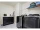 Convenient laundry room featuring modern appliances and ample counter space at 3079 Limber Pine Dr, Whiteland, IN 46184