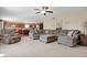 Cozy living room with plush seating, hardwood floors, and an open view to the kitchen area at 3079 Limber Pine Dr, Whiteland, IN 46184