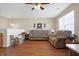 Spacious living room featuring a hardwood floor and neutral decor at 3079 Limber Pine Dr, Whiteland, IN 46184