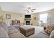 Inviting living room with a stone fireplace and cozy sectional sofa at 3079 Limber Pine Dr, Whiteland, IN 46184