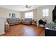 Comfortable living room featuring hardwood floors and natural light at 3079 Limber Pine Dr, Whiteland, IN 46184