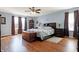 Spacious main bedroom with hardwood floors, large windows, and stylish decor at 3079 Limber Pine Dr, Whiteland, IN 46184