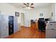 The office space offers wood floors, a ceiling fan, a desk, and filing cabinet storage at 3079 Limber Pine Dr, Whiteland, IN 46184