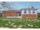 Backyard featuring grass, a wood deck and partial brick back of the house at 3125 Anniston Dr, Indianapolis, IN 46227