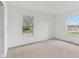 Bright bedroom featuring neutral carpeting and 2 windows with an exterior view at 3125 Anniston Dr, Indianapolis, IN 46227
