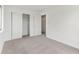 Bright bedroom featuring neutral carpeting, large closets and a doorway leading to an additional room at 3125 Anniston Dr, Indianapolis, IN 46227
