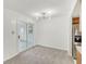 Open dining area with modern light fixture and sliding glass doors to patio at 3125 Anniston Dr, Indianapolis, IN 46227