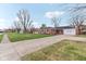 Charming brick home with a well-maintained lawn and a spacious driveway at 3125 Anniston Dr, Indianapolis, IN 46227